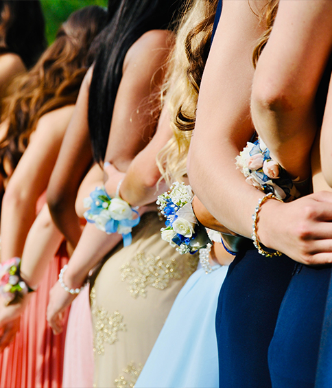 students wearing prom dresses