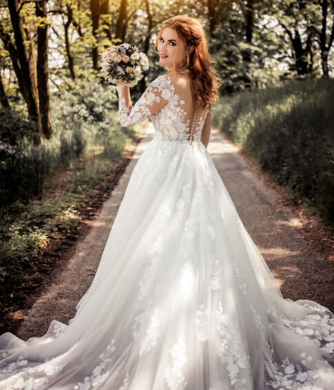 bride with her dress and flower bouquet